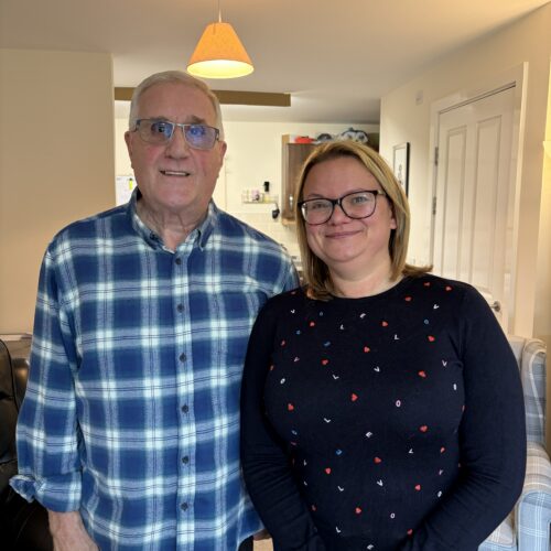 Elderly male resident pictured with female Employment and Money Adviser who has been supporting with him.