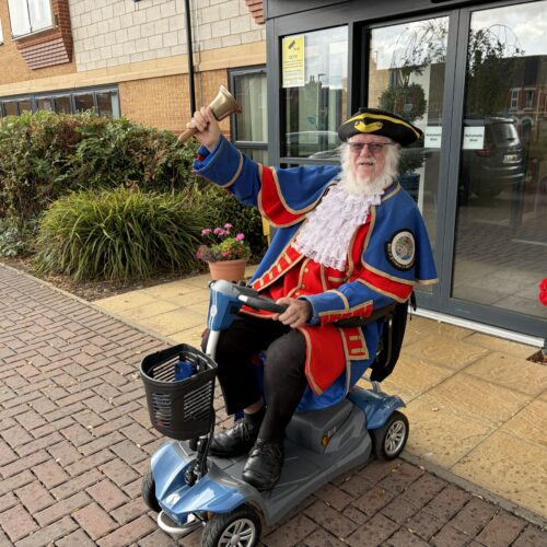 Town Crier ringing the bell outside ShireLiving’s Withywood residential scheme