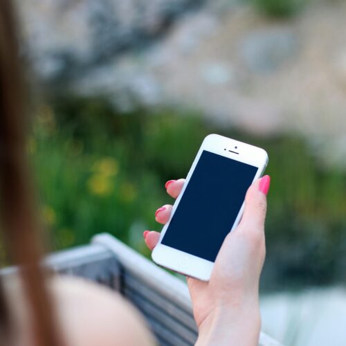 Mobile phone in person's hand